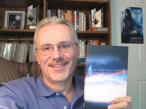 Doug holding copy of Chimerascope